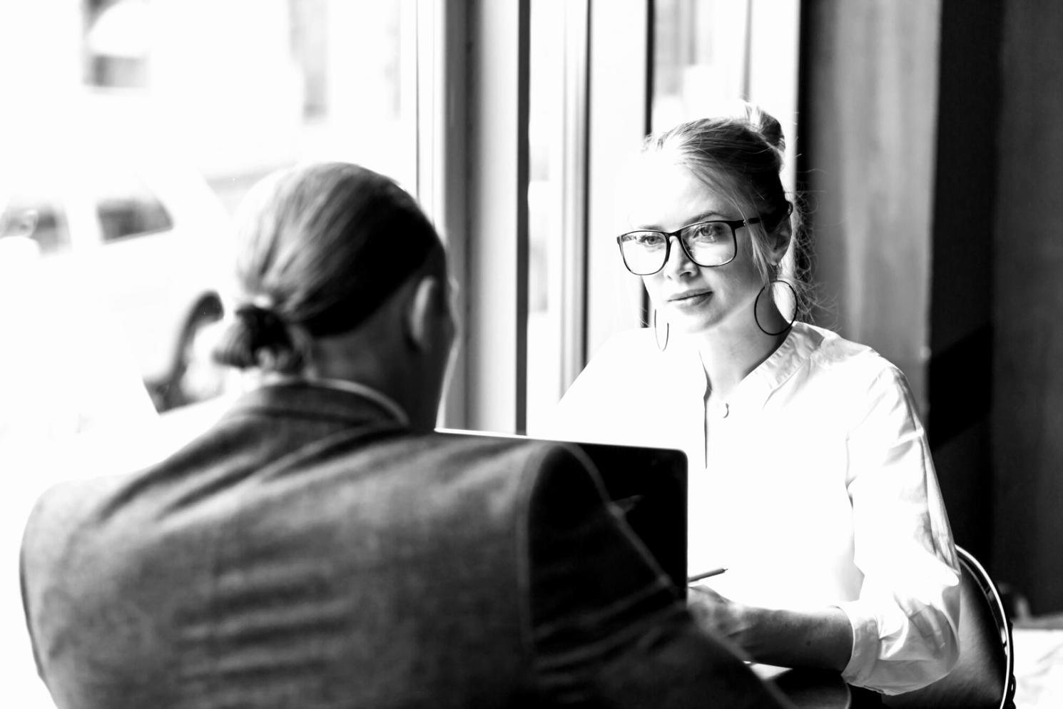 Team member reviewing financial mindset frameworks during consultation session